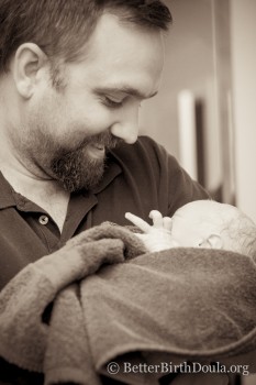 father first time holding baby